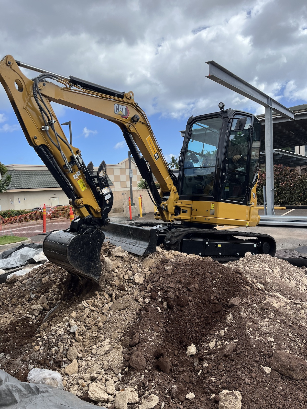 Our team operating an excavator machine to remove debris.