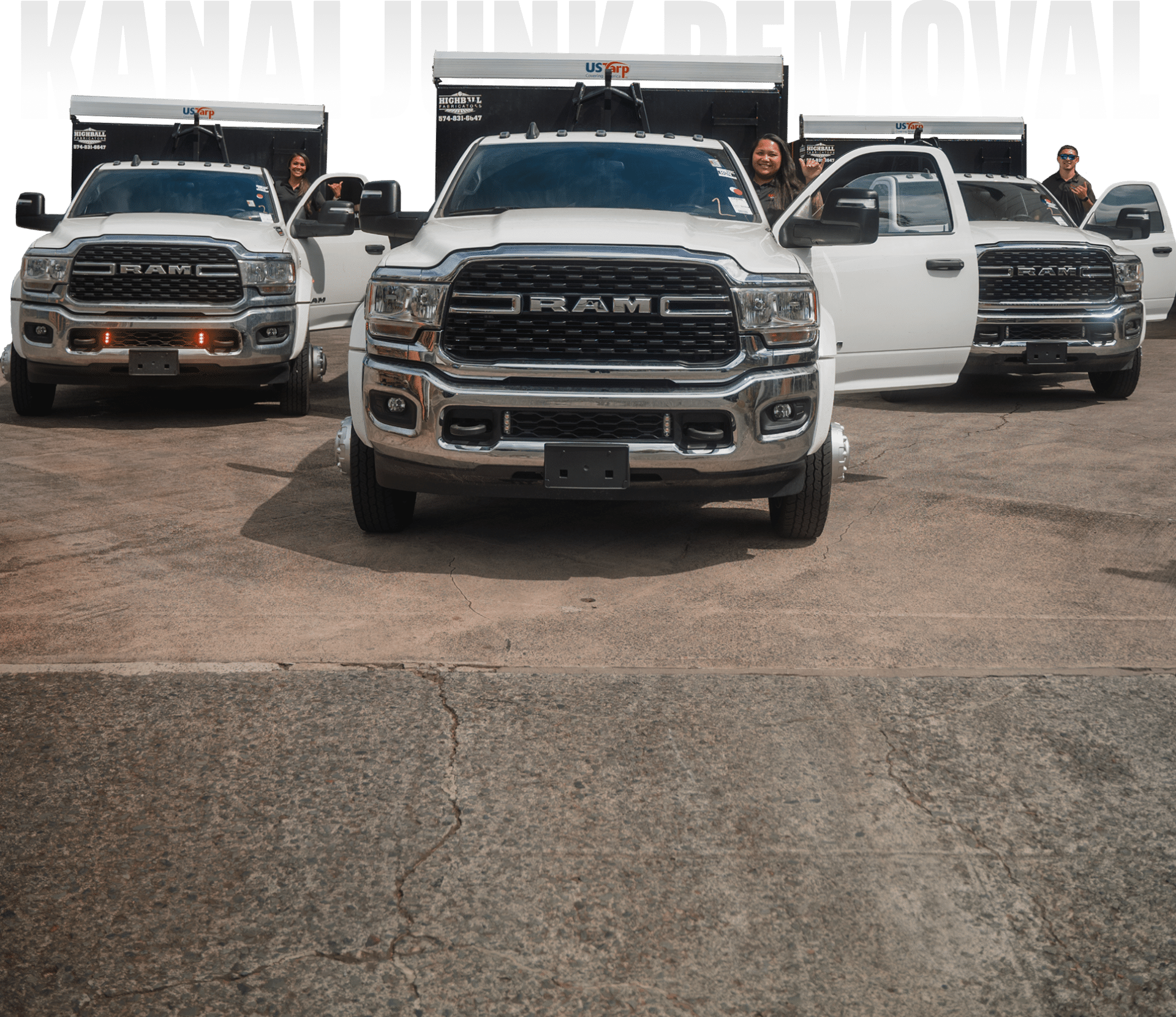 Three white RAM pickup trucks parked on pavement, two with open doors. Four people are standing beside or sitting in the trucks. Partial text "JUNK REMOVAL" visible at the top.